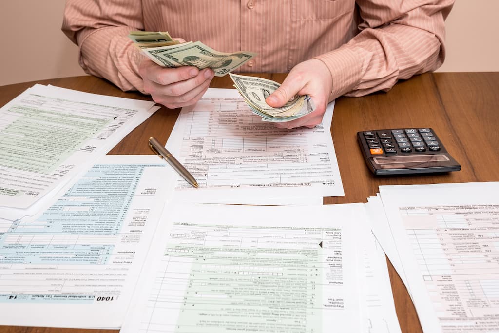 Businessman completing tax paperwork