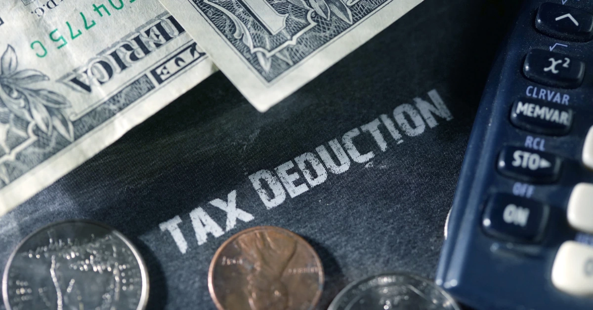 Section 199A tax deduction calculator with money showing pass-through entity savings