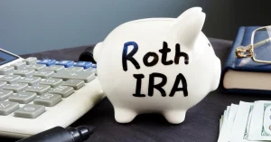 Roth IRA for kids piggy bank with calculator for retirement savings planning