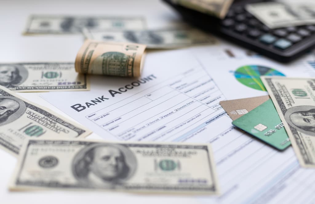 Cash money ready for deposit in a bank account